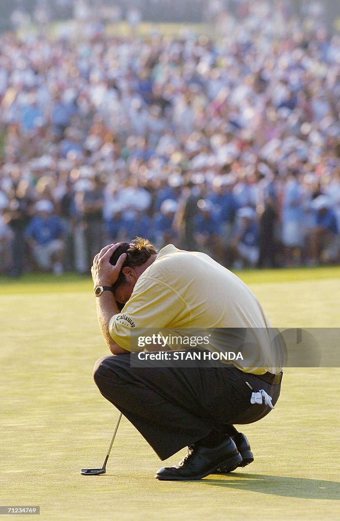 Phil Mickelson of the US holds his head