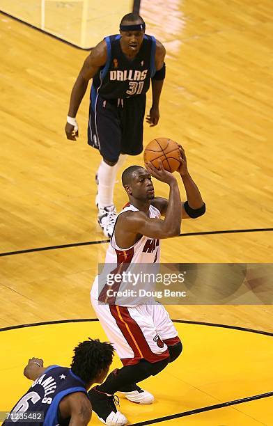 Dwyane Wade of the Miami Heat shoots one of two free throws in the final seconds of overtime in game five of the 2006 NBA Finals on June 18, 2006 at...