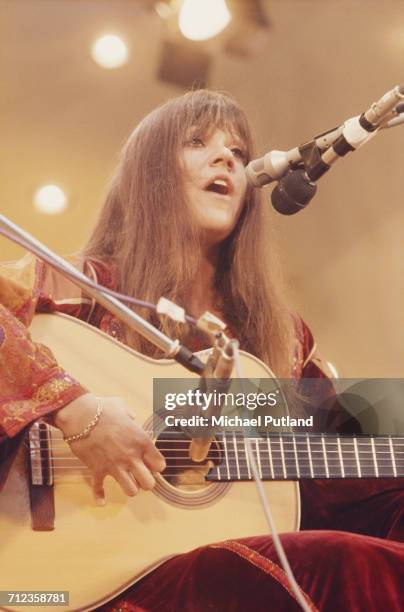 American singer and songwriter Melanie Safka performs live on stage playing an acoustic guitar at the Crystal Palace Bowl in London on 3rd June 1972.