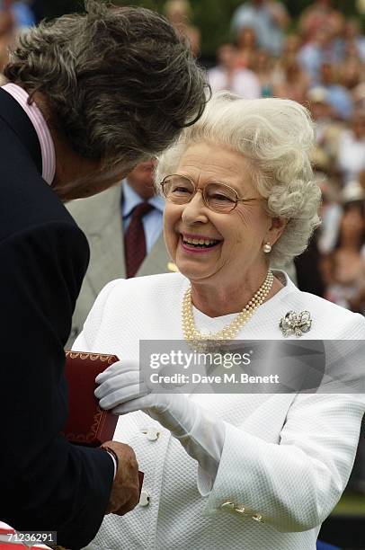 Queen Elizabeth II attends The Queen's Cup final at the Guards Polo Club on June 18, 2006 in Windsor, England. The Surrey major polo tournament,...