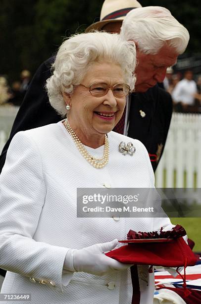 Queen Elizabeth II attends The Queen's Cup final at the Guards Polo Club on June 18, 2006 in Windsor, England. The Surrey major polo tournament,...