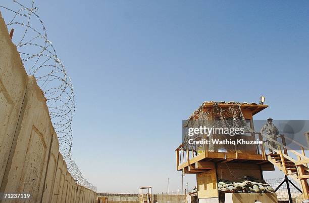 Soliders stand guard on June 19, 2006 at Abu Ghraib prison west of Baghdad, Iraq. More than 300 detainees were released on June 19, 2006 from Abu...