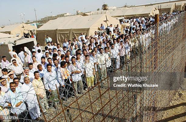Iraqi prisoners wait to be released on June 19, 2006 at Abu Ghraib prison west of Baghdad, Iraq. More than 300 detainees were released on June 19,...