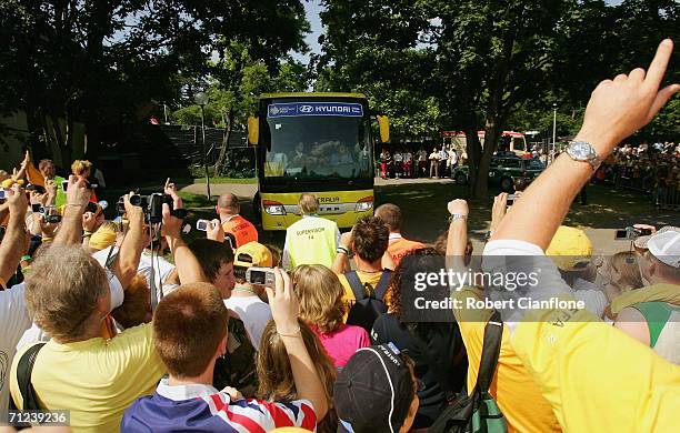 Australian fans cheer as the team bus arrives prior to the Australian training session at the Otto-Meister Stadium June 19, 2006 in Oehringen,...