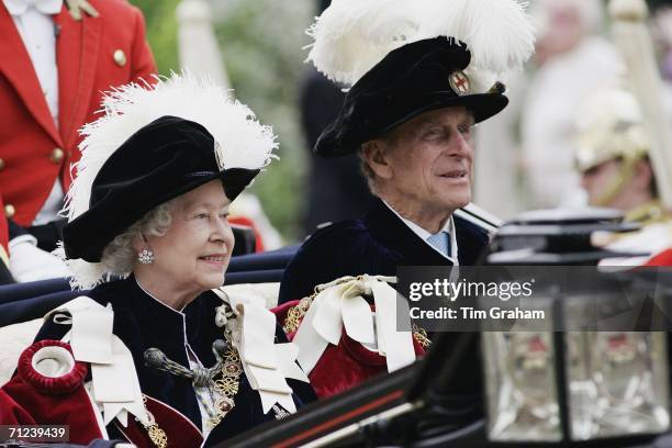Queen Elizabeth II, Sovereign of the Order and Prince Philip, Duke of Edinburgh attend the Order of The Garter Service and procession at St George's...