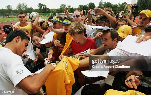 Tim Cahill of Australia signs autographs after the Australian training session at the Otto-Meister Stadium June 19, 2006 in Oehringen, Germany.