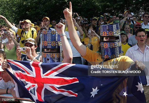 Australian fans wearing Ned Kelly helmets made from beer cartons cheer on the Socceroos during their open training session in Ohringen, 19 June 2006....