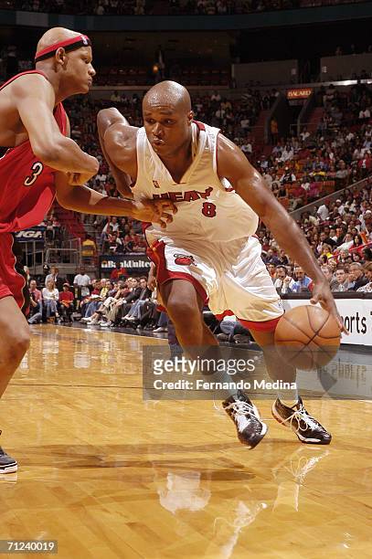 Antoine Walker of the Miami Heat drives around Charlie Villanueva of the Toronto Raptors on April 11, 2006 at American Airlines Arena in Miami,...