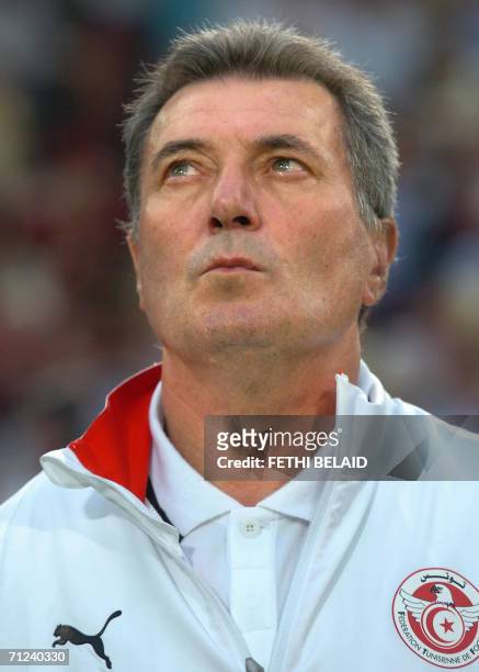 French head coach of the Tunisian team Roger Lemerre is seen before the start of the opening round Group H World Cup football match between Spain and...