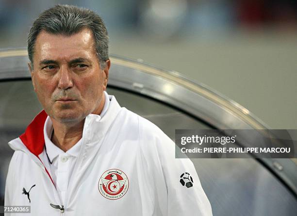 French head coach of the Tunisian team Roger Lemerre is seen in their opening round Group H World Cup football match against Spain at Stuttgart's...