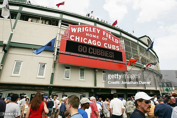Fans walk up to Wrigley Field before the Chicago Cubs game against the Detroit Tigers on June 17, 2006 at Wrigley Field in Chicago, Illinois. The...
