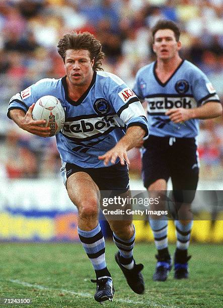 Andrew Ettingshausen of the Sharks makes a break during a NSWRL match between the Brisbane Broncos and the Cronulla Sharks at ANZ Stadium, 1993 in...