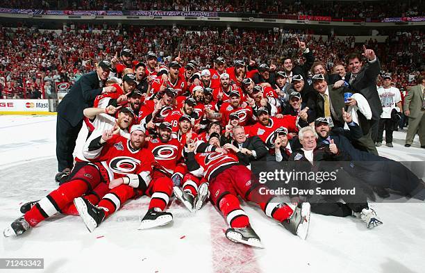 The Carolina Hurricanes pose together in celebration with the Stanley Cup after defeating the Edmonton Oilers in game seven of the 2006 NHL Stanley...