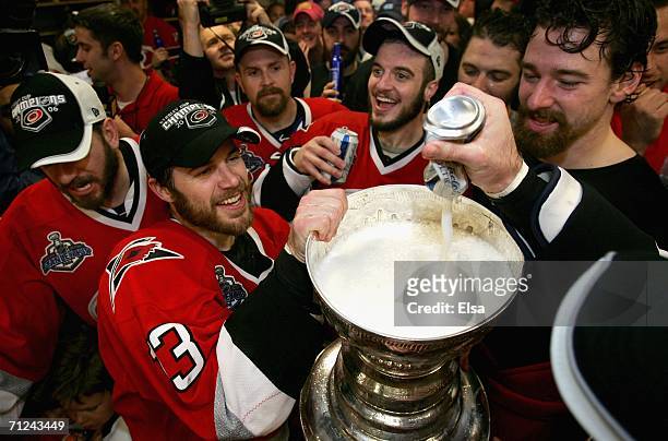 Ray Whitney and the Carolina Hurricanes celebrate in the lockerroom with the Stanley Cup after defeating the Edmonton Oilers in game seven of the...