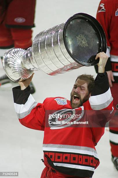 Doug Weight of the Carolina Hurricanes celebrates with the Stanley Cup after defeating the Edmonton Oilers in game seven of the 2006 NHL Stanley Cup...