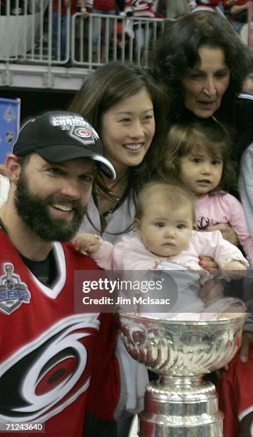 Figure skating Kristi Yamaguchi, husband Bret Hedican of the Carolina Hurricanes and family celebrate with the Stanley Cup after defeating the...