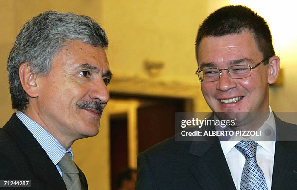 Italian Foreign Minister Massimo D'Alema smiles with his Romanian counterpart Mihai Razvan Ungureanu during their meeting at the Farnesina palace in...