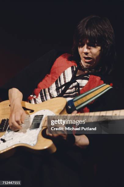Scottish musician and guitarist Jimmy McCulloch performs live on stage with rock group Wings on their Wings Over the World tour in March 1976.