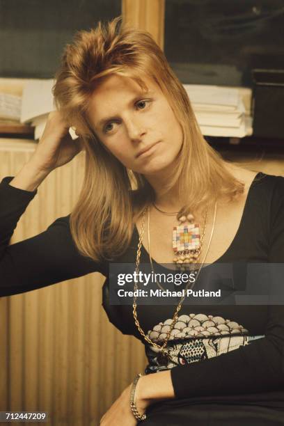 American photographer and musician with rock group Wings, Linda McCartney pictured sitting in an office in London on 23rd November 1973. Photo by...