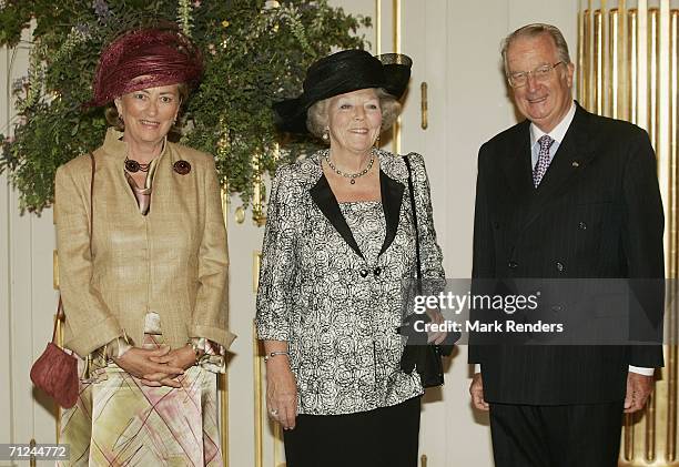 Belgian Queen Paola, Dutch Queen Beatrix and King Albert pose for a photo at the Royal Palace during a 3-day during visit by Queen Beatrix on June...