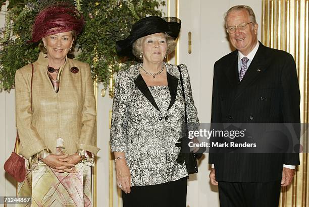 Belgian Queen Paola , Dutch Queen Beatrix and King Albert pose for a photo at the Royal Palace during a 3-day visit by Queen Beatrix on June 20, 2006...