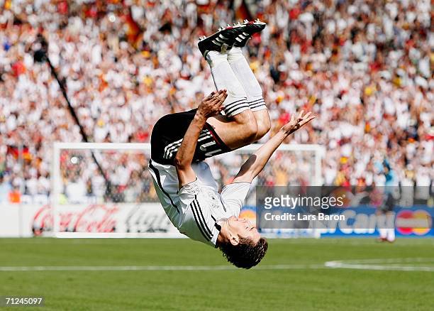 Miroslav Klose of Germany celebrates scoring the opening goal during the FIFA World Cup Germany 2006 Group A match between Ecuador and Germany played...