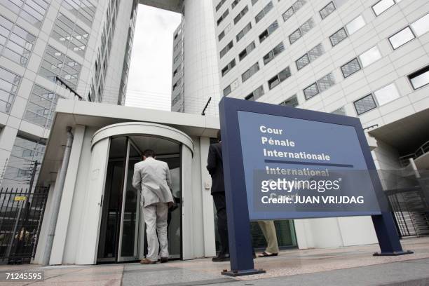 Den Haag, NETHERLANDS: People enter the International Criminal Court, 20 June 2006 in the Hague. Former Liberian president Charles Taylor was today...