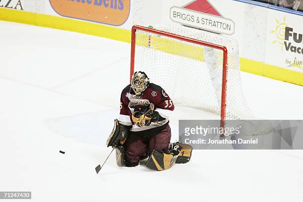 Frederic Cassivi of the Hershey Bears makes a save against the Milwaukee Admirals in game six of the Calder Cup Finals on June 15, 2006 at the...