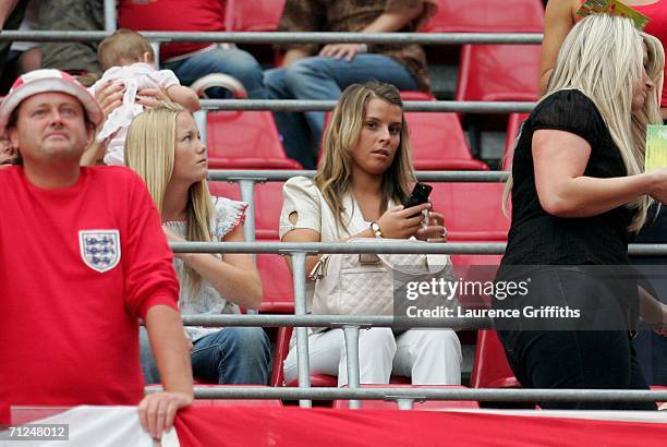 Coleen McLoughlin, Wayne Rooney's girlfriend sits in the stands during the FIFA World Cup Germany 2006 Group B match between Sweden and England at...