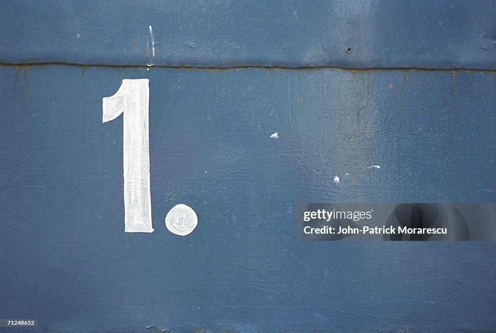 Number 1' painted on wall, close-up