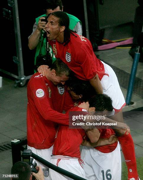 Rio Ferdinand of England celebrates with Joe Cole of England as he celebrates scoring a goal during the FIFA World Cup Germany 2006 Group B match...