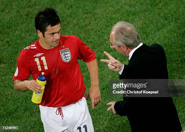 Joe Cole of England talks to England coach Sven Goran Eriksson during the FIFA World Cup Germany 2006 Group B match between Sweden and England at the...