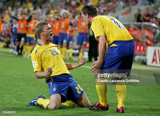 Marcus Allback of Sweden celebrates scoring a goal with Anders Svensson of Sweden during the FIFA World Cup Germany 2006 Group B match between Sweden...