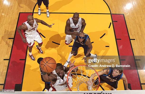 Dwyane Wade of the Miami Heat shoots against Dirk Nowitzki of the Dallas Mavericks during Game Three of the 2006 NBA Finals on June 13, 2006 at the...