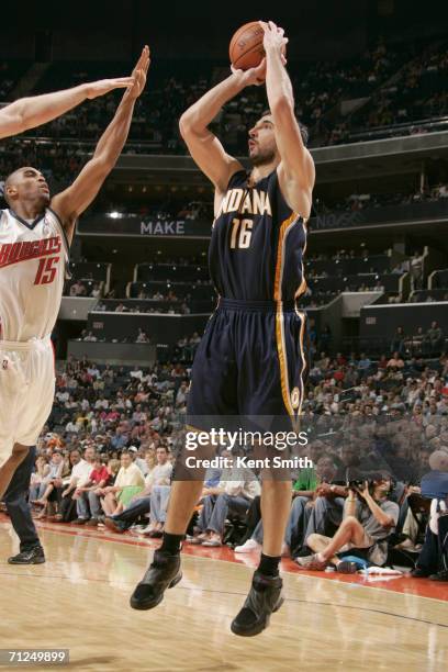 Peja Stojakovic of the Indiana Pacers shoots over Alan Anderson of the Charlotte Bobcats on April 15, 2006 at the Charlotte Bobcats Arena in...