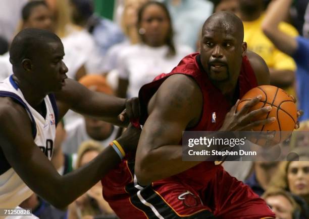 Shaquille O'Neal of the Miami Heat posts up DeSagana Diop of the Dallas Mavericks in the first quarter of game six of the 2006 NBA Finals on June 20,...