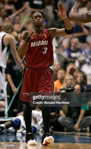 Dwyane Wade of the Miami Heat celebrates a play in the third quarter against the Dallas Mavericks in game six of the 2006 NBA Finals on June 20, 2006...