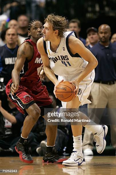 Dirk Nowitzki of the Dallas Mavericks moves around Udonis Haslem of the Miami Heat in the first quarter of game six of the 2006 NBA Finals on June...