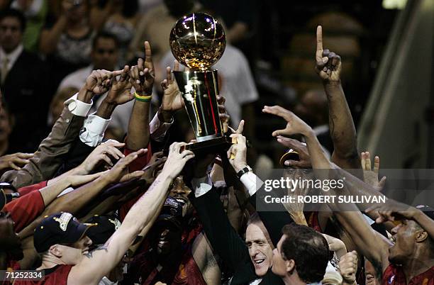 Dallas, UNITED STATES: Head coah Pat Riley and the Miami Heat celebrate winning Game Six of the NBA Finals 95-92 against the Dallas Mavericks 20 June...