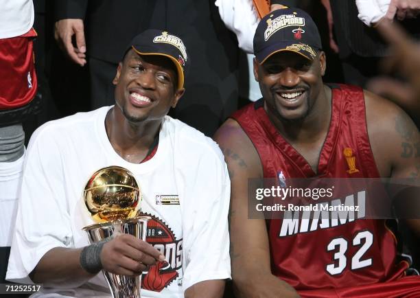 Series MVP Dwyane Wade and Shaquille O'Neal of the Miami Heat celebrate together after the Heat defeated the Dallas Mavericks in game six of the 2006...