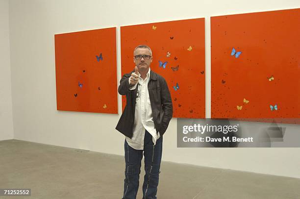 Damien Hirst gestures as he attends his 'A Thousand Years and Triptychs' private view at the Gagosian Gallery on June 20, 2006 in London, England.