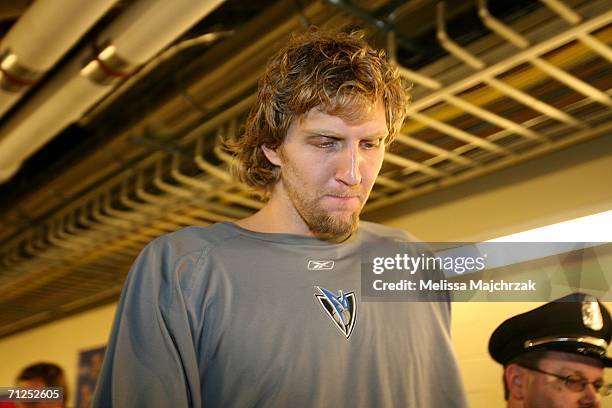 Dirk Nowitzki of the Dallas Mavericks walks through the hall ways of the arena after the Mavs 95-92 loss against the Miami Heat during Game Six of...