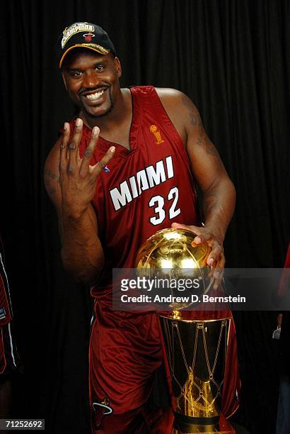 Shaquille O'Neal of the Miami Heat poses for a portrait with the Larry O'Brien Championship trophy after their 95-92 Game Six victory of the 2006 NBA...