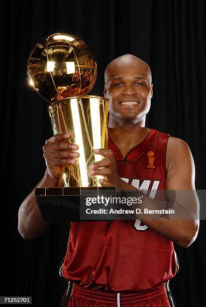 Antoine Walker of the Miami Heat poses for a portrait with the Larry O'Brien Championship trophy after their 95-92 Game Six victory of the 2006 NBA...