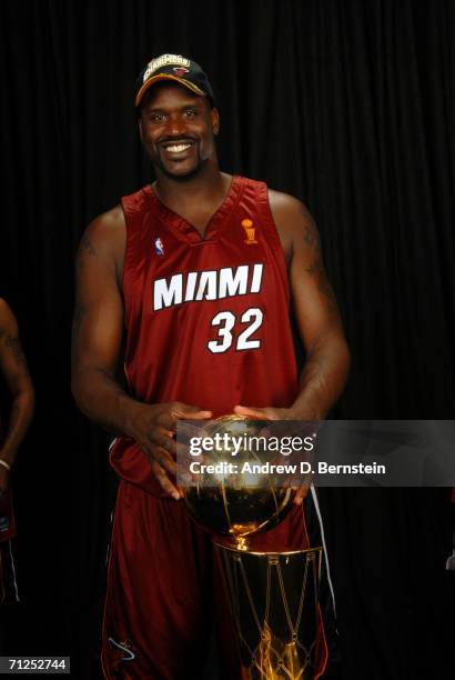 Shaquille O'Neal of the Miami Heat poses for a portrait with the Larry O'Brien Championship trophy after their 95-92 Game Six victory of the 2006 NBA...