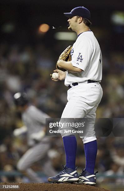 Brad Penny of the Los Angeles Dodgers spits after giving up a homerun to Richie Sexson of the Seattle Mariners in the fifth inning at Dodger Stadium...