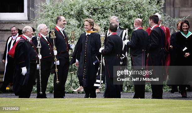 Michael Douglas walks into the quadrangle after receiving his honorary degree from St Andrews University July 21 St Andrews in Scotland.