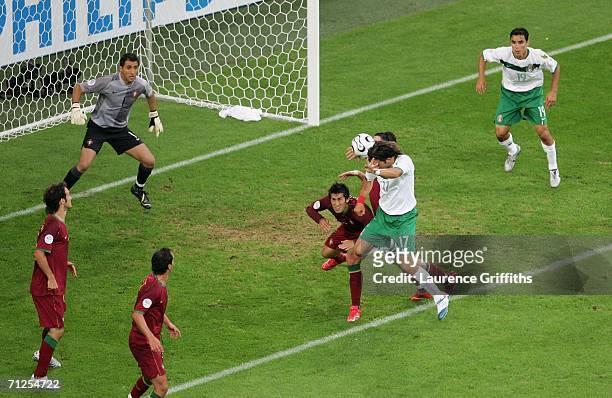 Jose Fonseca of Mexico wins the header and scores their first goal of the game during the FIFA World Cup Germany 2006 Group D match between Portugal...