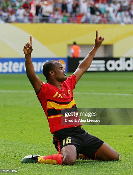 Flavio of Angola falls to his knees in celebration after scoring the opening goal during the FIFA World Cup Germany 2006 Group D match between Iran...