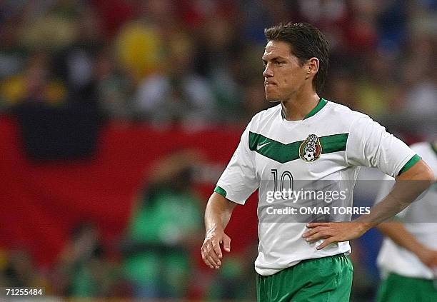 Gelsenkirchen, GERMANY: Mexican forward Guillermo Franco looks dejected at the end of the World Cup 2006 group D football game Portugal vs. Mexico,...